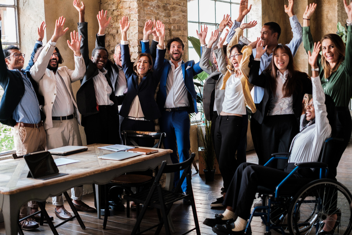 Group of businessmen of different ethnic backgrounds celebrating successes together