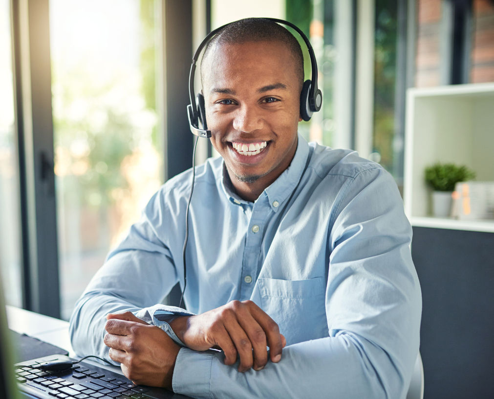 Cropped shot of a young handsome male customer support agent working in the office