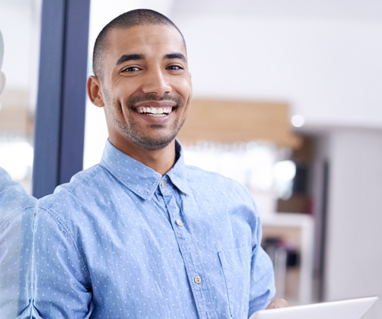 Shot of a young entrepreneur using a digital tablet in a modern office