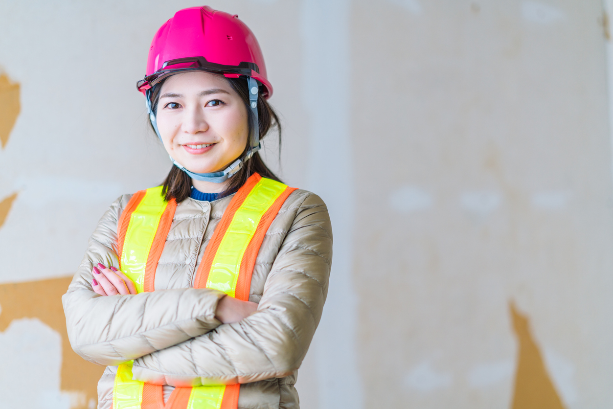 A portrait of a confident female construction worker.