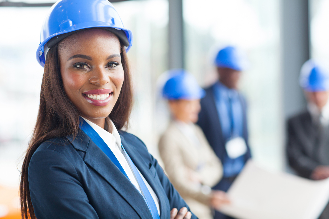 pretty african american female construction worker in office