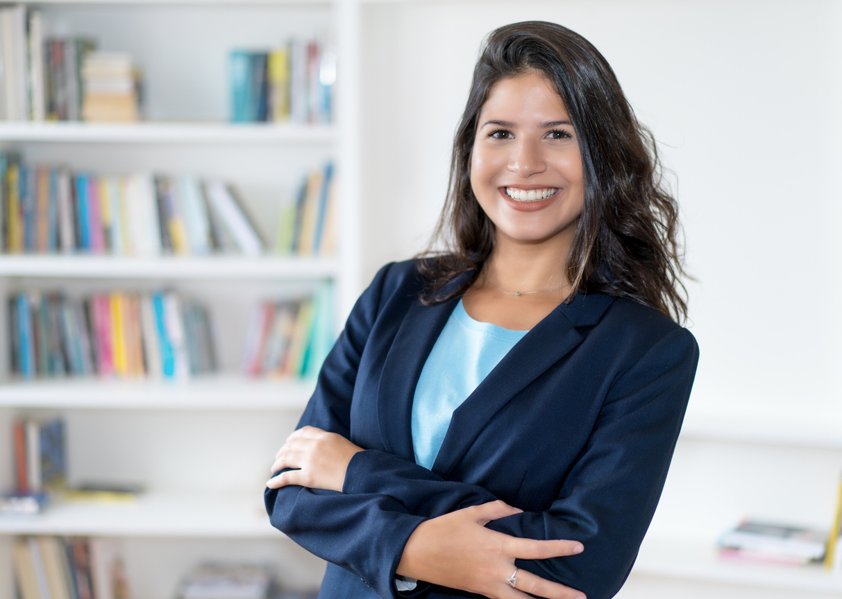 Female business trainee with long dark hair isolated on white background for cut out